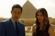 Raymond Lee as Dr. Ben Song, Caitlin Bassett as Addison in front of the pyramids in Egypt in 'Quantum Leap' - Season 2, Episode 8