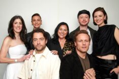 (L-R) 'Outlander's Maril Davis, Richard Rankin, Sophie Skelton, Diana Gabaldon, Sam Heughan, John Bell, and Caitríona Balfe in TV Insider's NYCC 2024 portrait studio