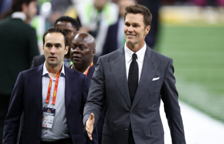 Tom Brady walks across the field before Super Bowl LIX